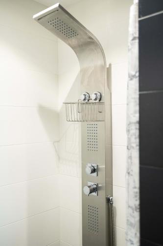 a bathroom with a shower with a shower head at Beachfront Artemida Retreat - Peony Seabreeze Gem in Artemida