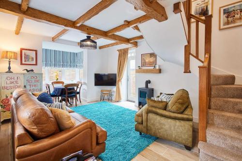 a living room with a couch and chairs at Host & Stay - The Snug in Hunmanby