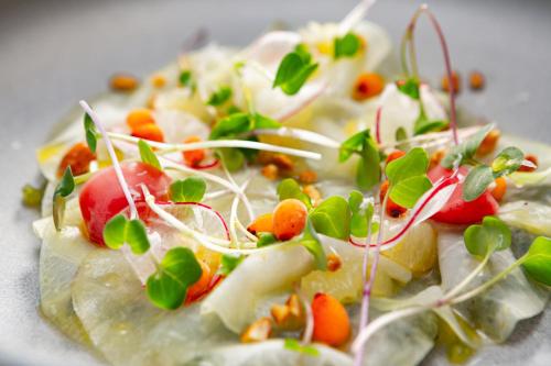 a plate of food with vegetables on it at Grand Hotel River Park, a Luxury Collection Hotel, Bratislava in Bratislava