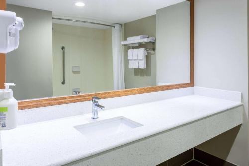 a bathroom with a sink and a mirror at Baymont by Wyndham Budd Lake in Budd Lake