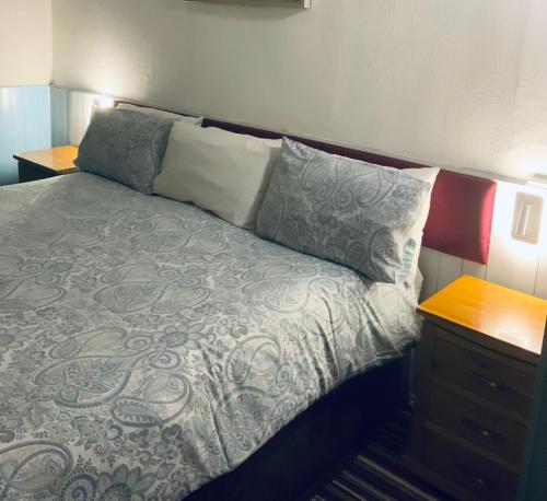 Cama o camas de una habitación en Bromptons