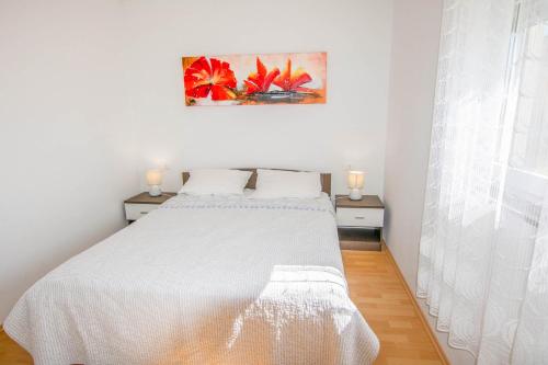 Giường trong phòng chung tại Apartments Etera
