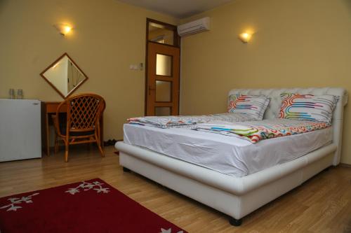 Postel nebo postele na pokoji v ubytování Hotel Fontana