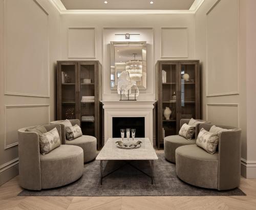 a living room with two chairs and a coffee table at The Hotel Maria Helsinki in Helsinki
