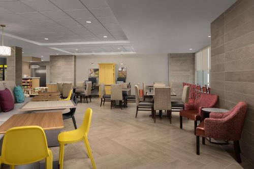 a dining room with tables and chairs and tablesktop at Home2 Suites By Hilton Abilene Southwest in Abilene