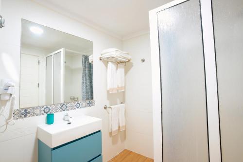 a bathroom with a sink and a mirror at Balcon del Mar in Puerto Rico de Gran Canaria