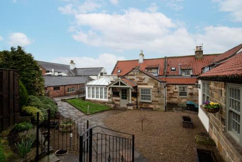 a view of a courtyard of a house at The King's Head Inn - The Inn Collection Group in Great Ayton