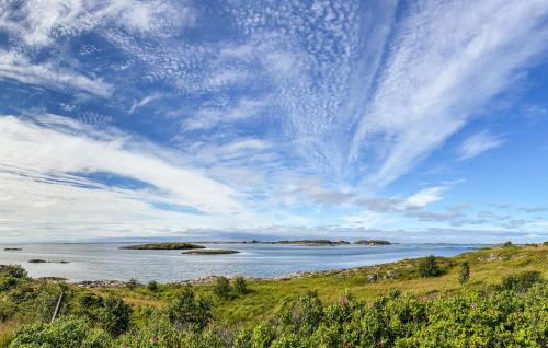 a large body of water under a cloudy sky at Nice Home In Smøla With House Sea View in Smøla