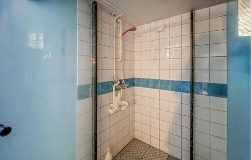 a bathroom with a shower with a glass door at Amazing Home In Hrryda With Sauna in Härryda