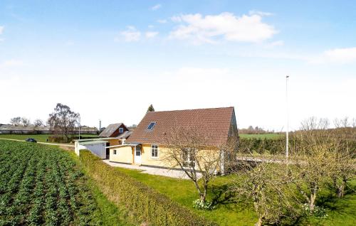 a farm with a house and a field of crops at Amazing Home In Nordborg With Kitchen in Nordborg