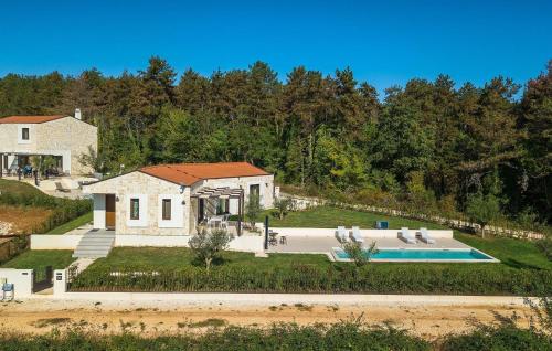 an aerial view of a house with a swimming pool at Villa-Vesta in Višnjan