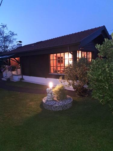 a house with a candle in front of a yard at Ferienhaus Kumpitsch in Sankt Johann im Saggautal