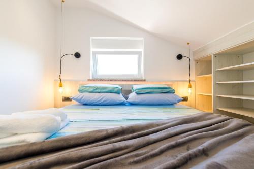 Posteľ alebo postele v izbe v ubytovaní Apartments Janeš