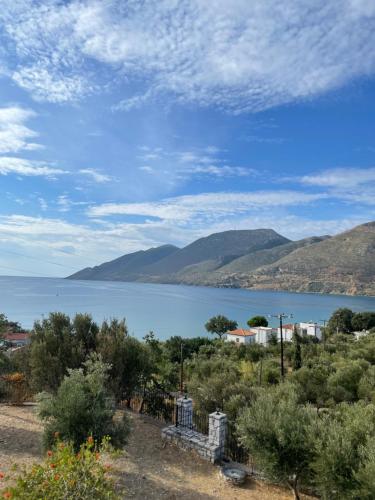 a view of a lake with mountains in the background at Skoutari Bungalows Galateia room in Skoutarion