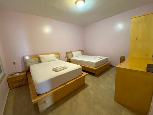 En eller flere senge i et værelse på Spencer Residencial APARTAMENTOS