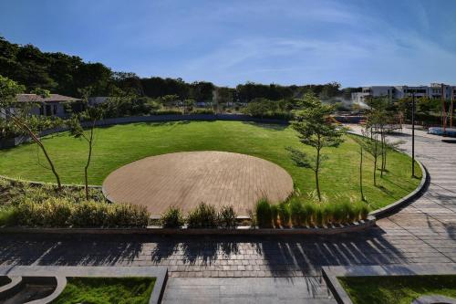 an overhead view of a large grassy park with trees at Antarim Express in Bharuch