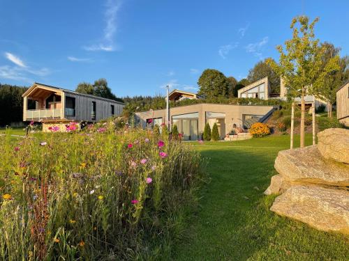 a field of flowers in the yard of a house at Feriendorf Waidlerland in Mauth