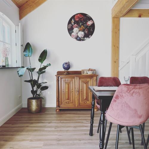 a dining room with a table and two chairs at Noxem b&b in Boesingheliede