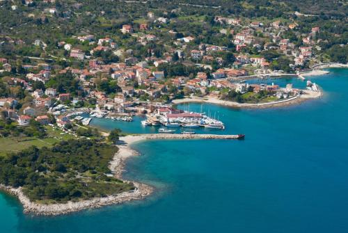 an aerial view of a harbor with boats in the water at House ROSSELLA with cozy apartment and rooms close to the beach in Nerezine