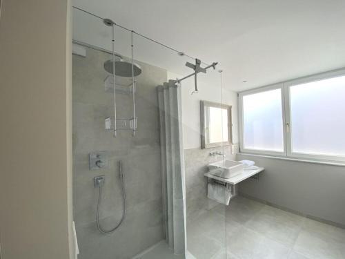 a bathroom with a shower and a sink at Holiday apartment Seeloft in Konstanz