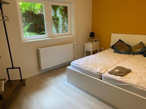 a bedroom with a large bed and a window at Holiday home Waldhaus St Martin in Sankt Martin