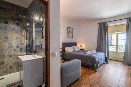 Ένα ή περισσότερα κρεβάτια σε δωμάτιο στο Casa dos Arcos - Charm Guesthouse