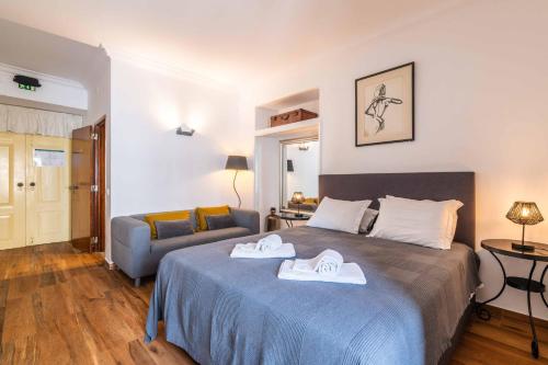 Ένα ή περισσότερα κρεβάτια σε δωμάτιο στο Casa dos Arcos - Charm Guesthouse