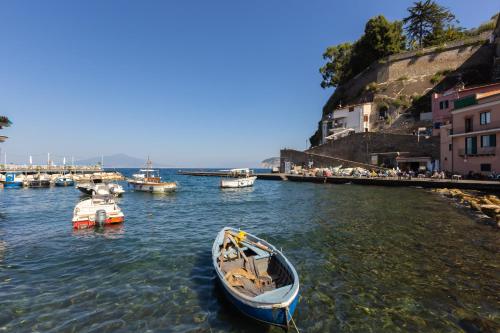 a boat is docked in the water in a harbor at Marinautica Sea Cottage in Sorrento