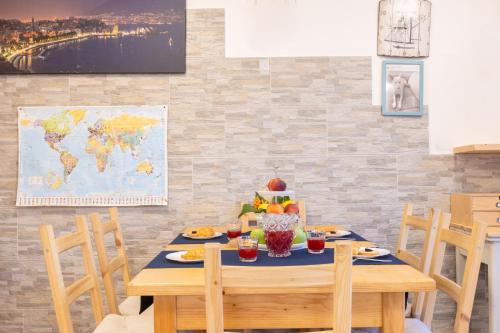 a dining room with a table with fruit on it at Marinautica Sea Cottage in Sorrento