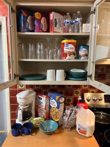 a kitchen pantry with food items on a counter at Hole in the Wall Getaway - USA Mexico Border Bed and Breakfast in Columbus