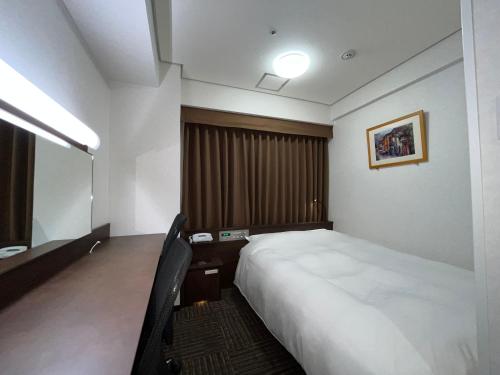 Postel nebo postele na pokoji v ubytování Hotel Alpha-One Yonago
