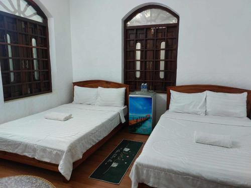 Giường trong phòng chung tại Sunny Homestay