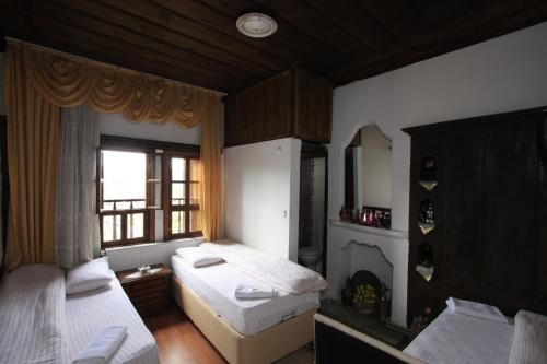 Postel nebo postele na pokoji v ubytování Efe Guest House