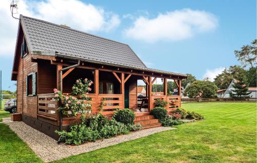 a log cabin with a gazebo at Amazing Home In Stepnica With Kitchen in Stepnica