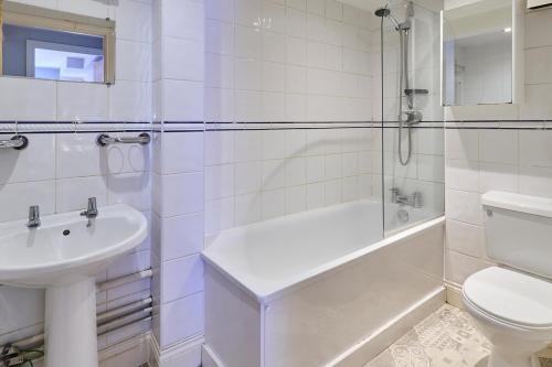 a bathroom with a sink and a toilet and a shower at Host & Stay - Roper Road in Canterbury