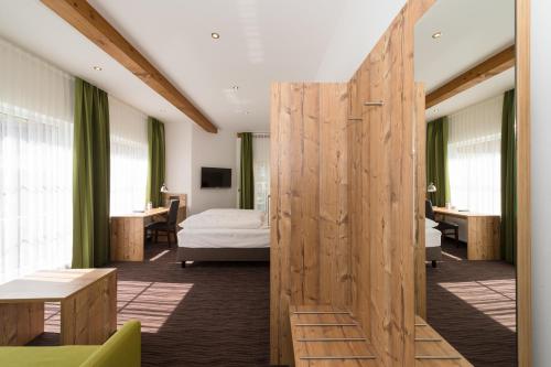 Postel nebo postele na pokoji v ubytování Hotel SCHNEIDER