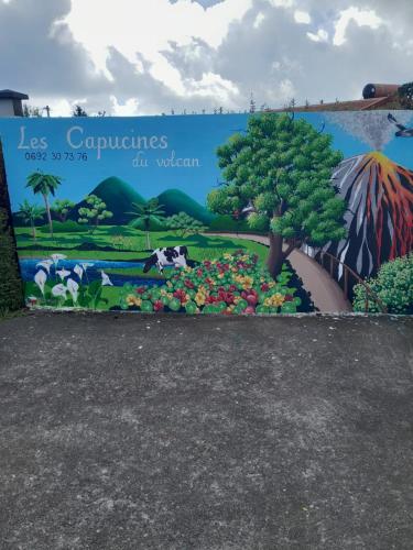 a mural at the entrance to los copaciones city vistas at petite chambre vue piton des neiges Les Capucines du volcan in La Plaine des Cafres