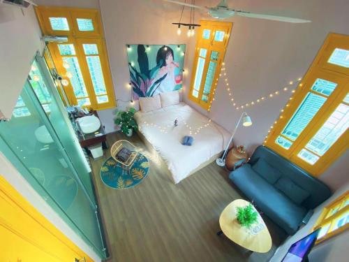 an overhead view of a living room with a blue couch at MAY - YELLOW 02 - Phone 09756-59323 in Hanoi