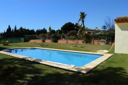 Piscina en o cerca de Chalet Piscina Privada Urbanización Roche Viejo