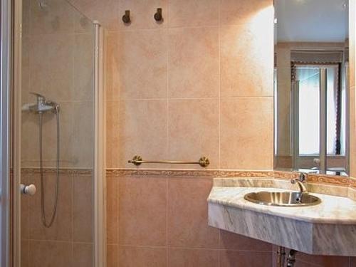 a bathroom with a shower and a sink at Casa Rural Roblegordo in Rabanera del Pinar