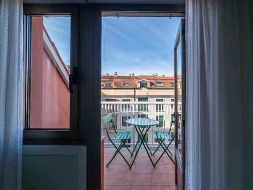 a view of a balcony with a table and chairs at Apartment Edificio Bahia II by Interhome in Miño