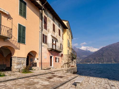 an old building next to a body of water at Apartment Gaetano - SRZ310 by Interhome in Rezzonico