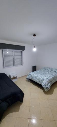 Кровать или кровати в номере Los Maitenes 888