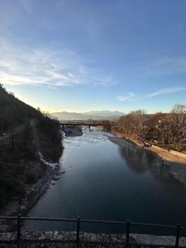 a view of a river with a bridge in the background at Casa Di Munti in Konitsa