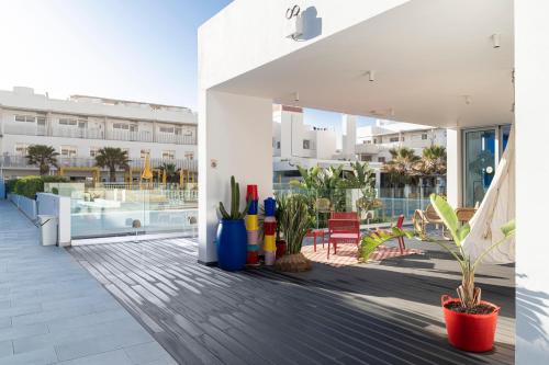 a view of the pool from the balcony of a building at Buendía Corralejo Nohotel in Corralejo