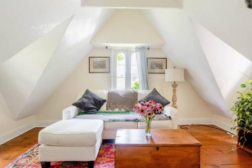 a living room with a white couch and a table at The Gables of Rhinebeck in Rhinebeck