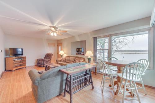 a living room with a couch and a table at Waterfront Lake Holcombe Getaway with Dock in Conrath