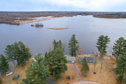 an aerial view of a lake with trees at Waterfront Lake Holcombe Getaway with Dock in Conrath