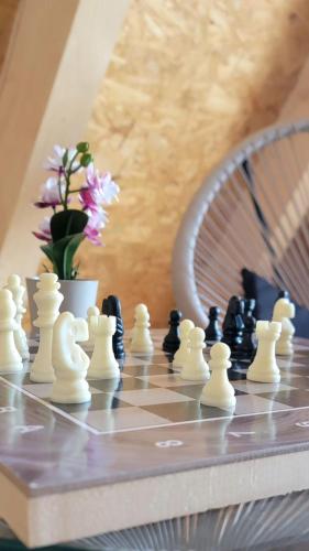 a chess board with chess pieces on a table at Kuća za odmor Villa Kovačević in Bihać