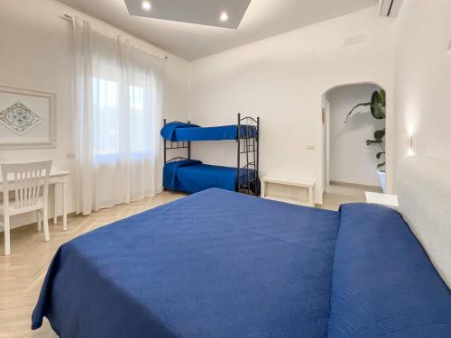 Ένα ή περισσότερα κρεβάτια σε δωμάτιο στο Divina Costiera
